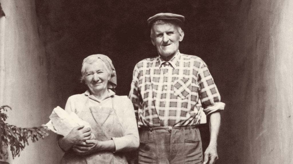 black and white image of grandmother and grandfather standing side by side