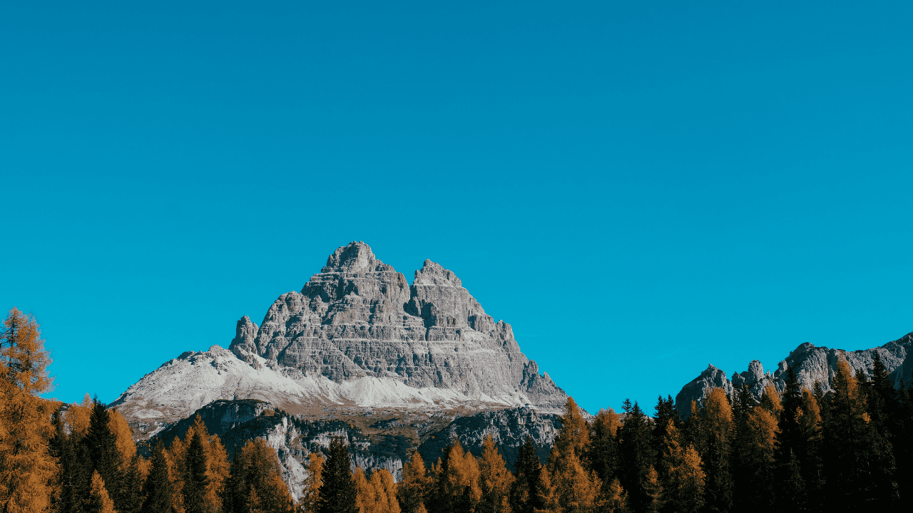 mountain showing top point into the blue sky for top talent